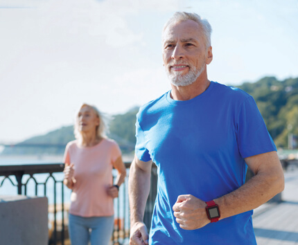 Older couple jogging